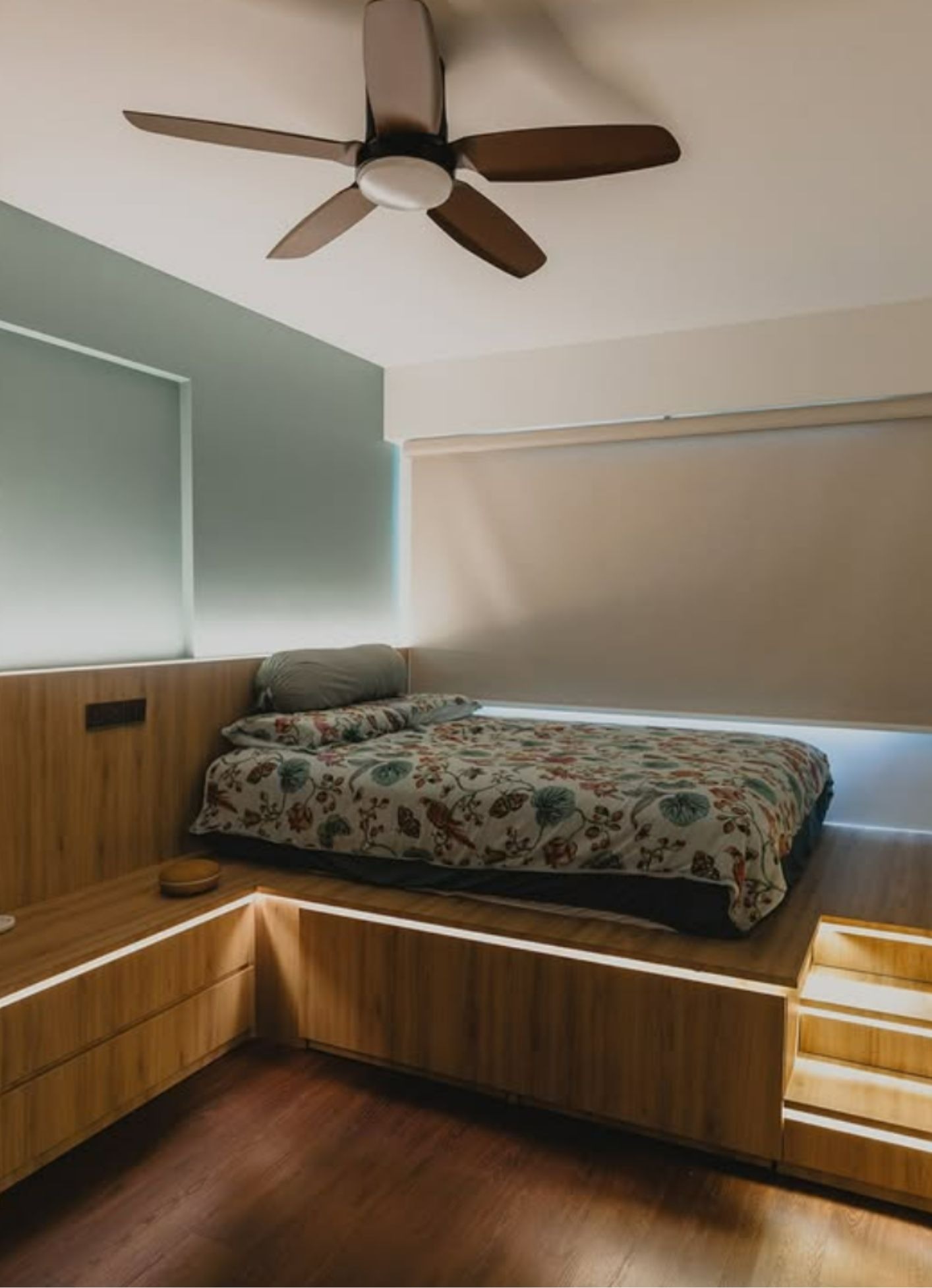 Master bedroom with platform bed, built-in storage drawers and LED strip lighting